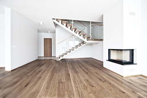 empty bright room with three windows and tiles