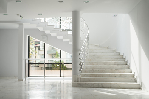 Interior of a building with white color walls. Flight of stairs